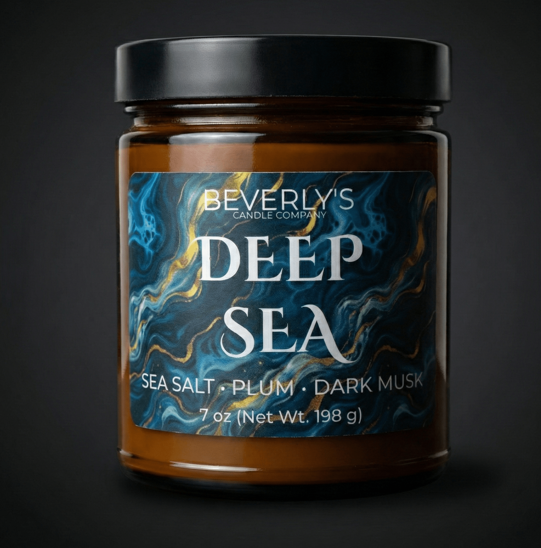 Jar of Beverly's Deep Sea candle with a dark label on a black background
